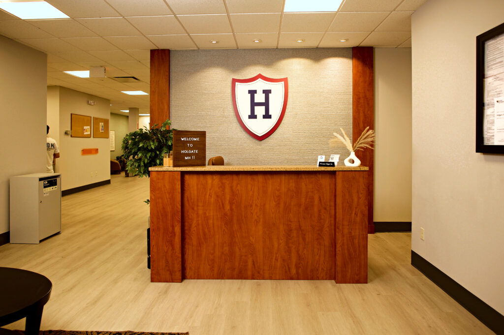 Front desk and lobby at Holgate Mental Health in Montvale, NJ, with the Holgate shield logo